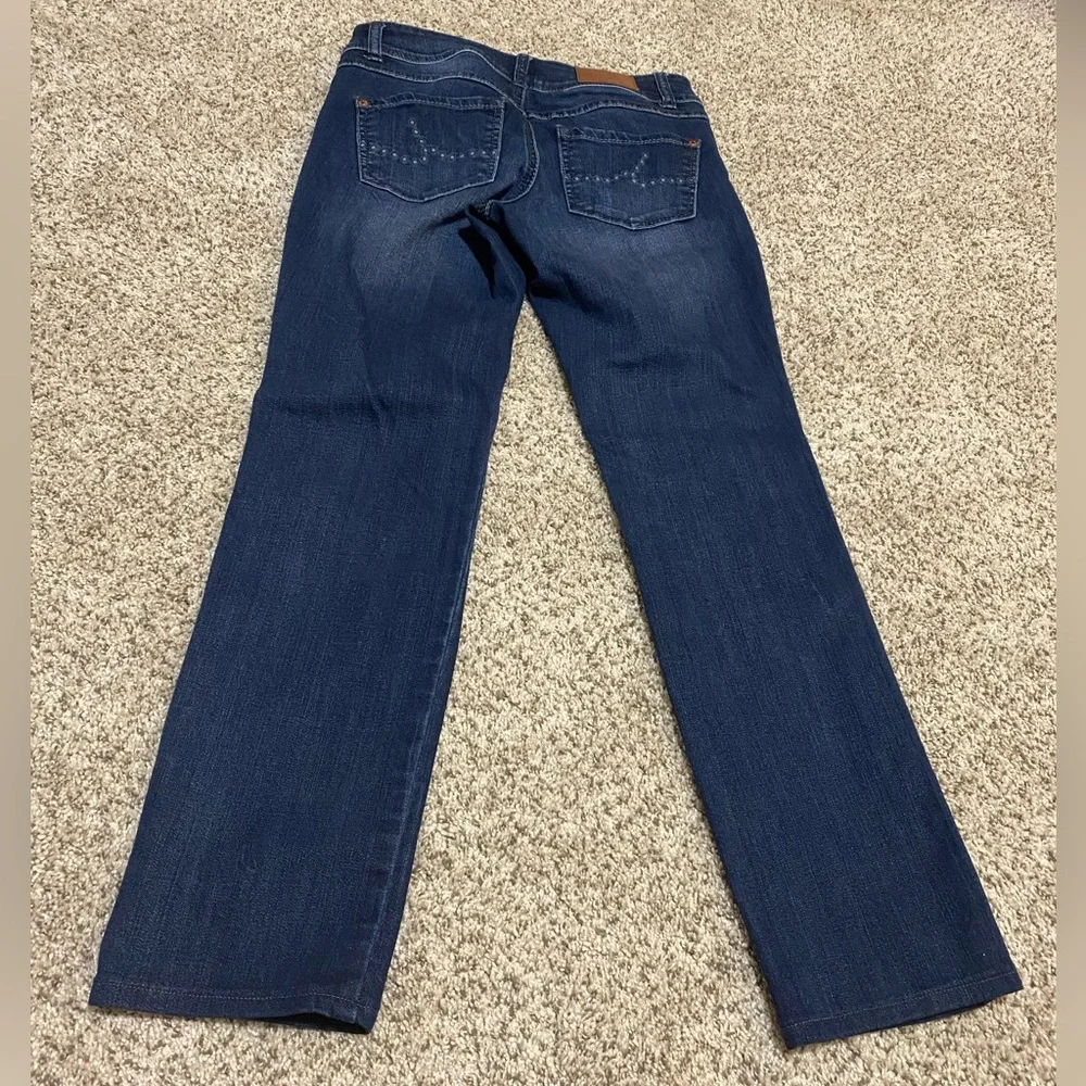 Women’s straight leg jeans by INC; size 2